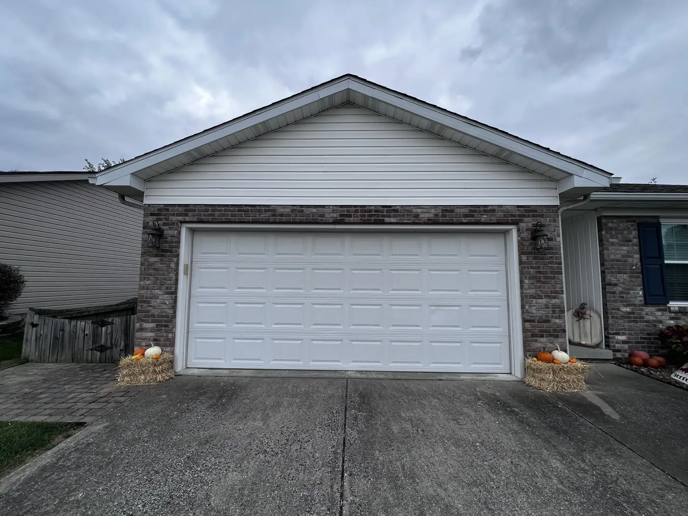 Clean concrete apron in front of a two-car garage