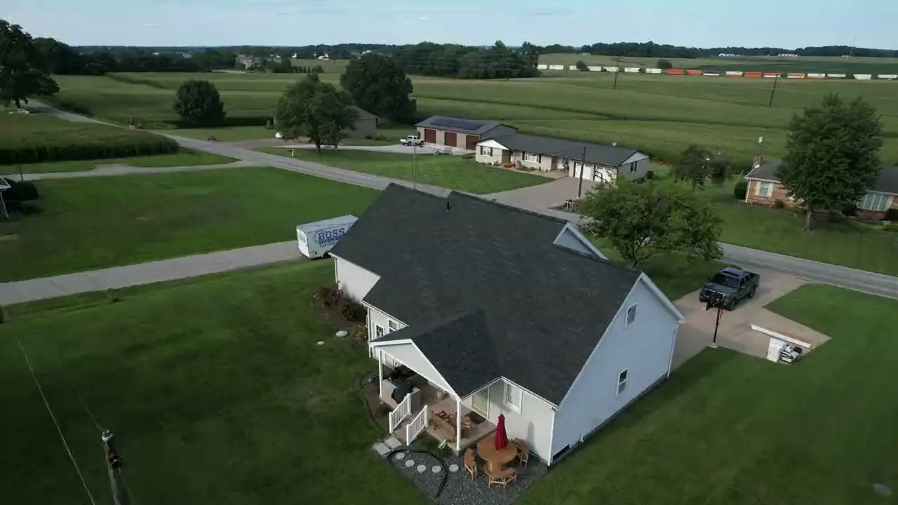 Aerial view over a Southern Indiana subdivision with farmland behind
