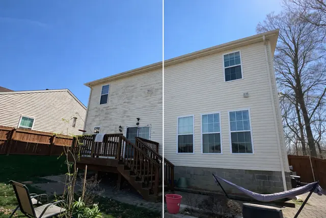 Vinyl siding before and after washing, the left half green and the right half clean